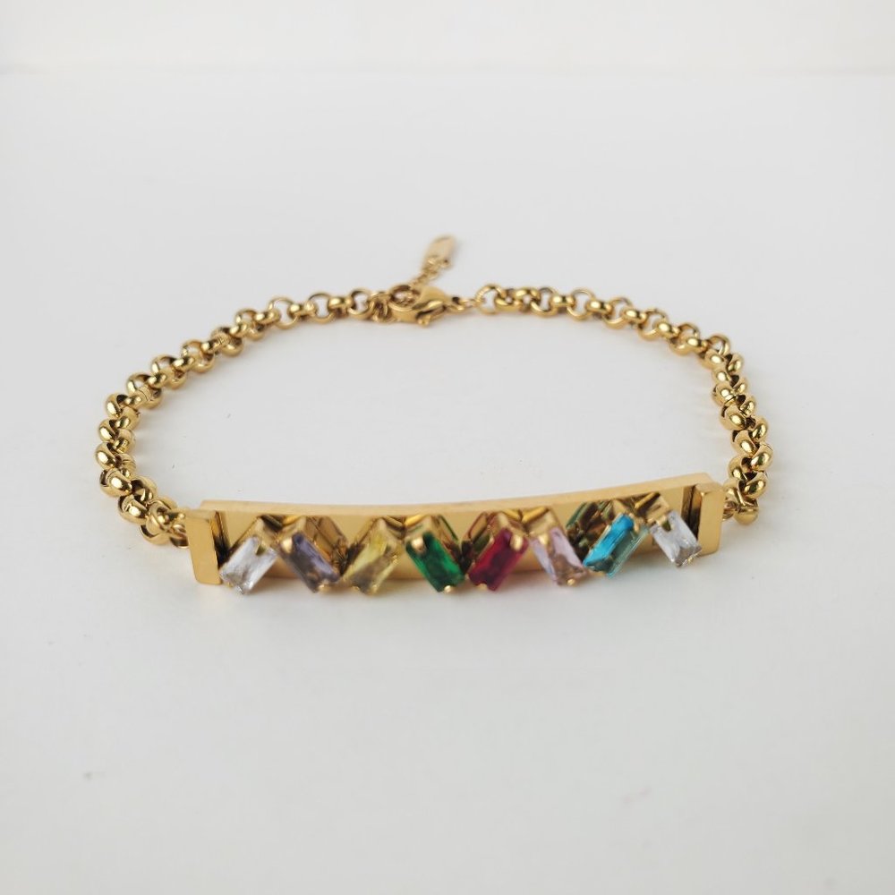 Bracelet new with tags , stainless steel, color gold ,red, blue ,green & purpkle